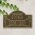 All Dogs Go to Heaven Wall/Lawn Plaque in Antique Brass on Wall with Vines Growing on Top