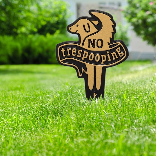 No Trespooping in Lawn Sign in Black & Gold Staked in Lush Green Grass on the sidewalk