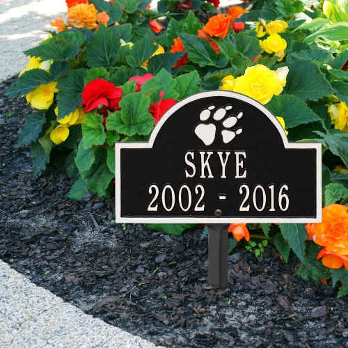 Black & White Dog Paw Arch Lawn Memorial Marker on the Sidewalk